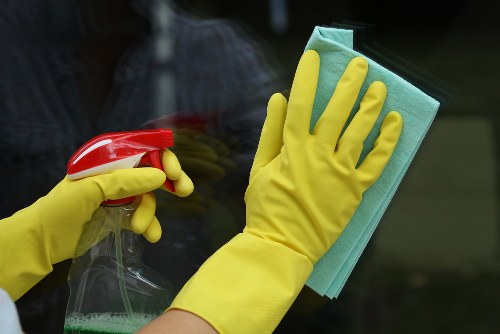 Domestic cleaner working in a Chelsea townhouse living room