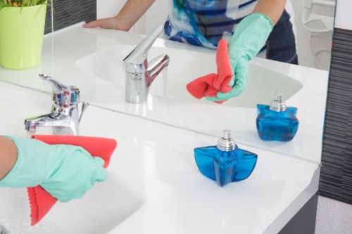 Cleaners working in a Chelsea townhouse living room