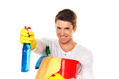 Local oven cleaner working in a Chelsea apartment kitchen